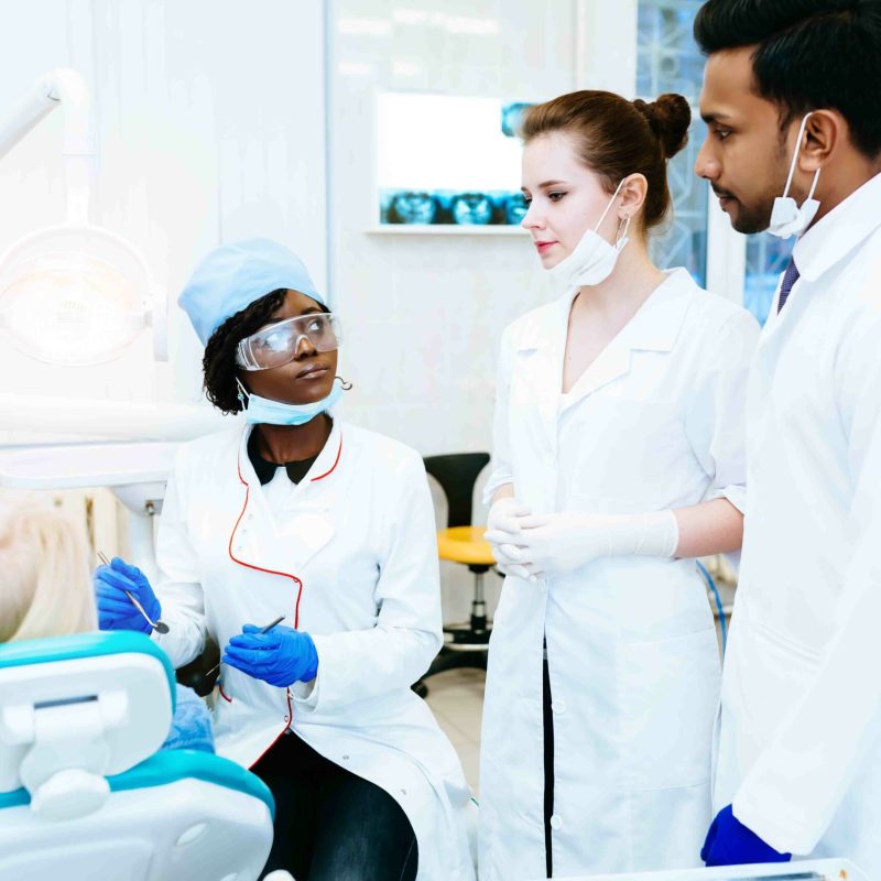 Multiracial dental team in dental clinic. Dental health concept